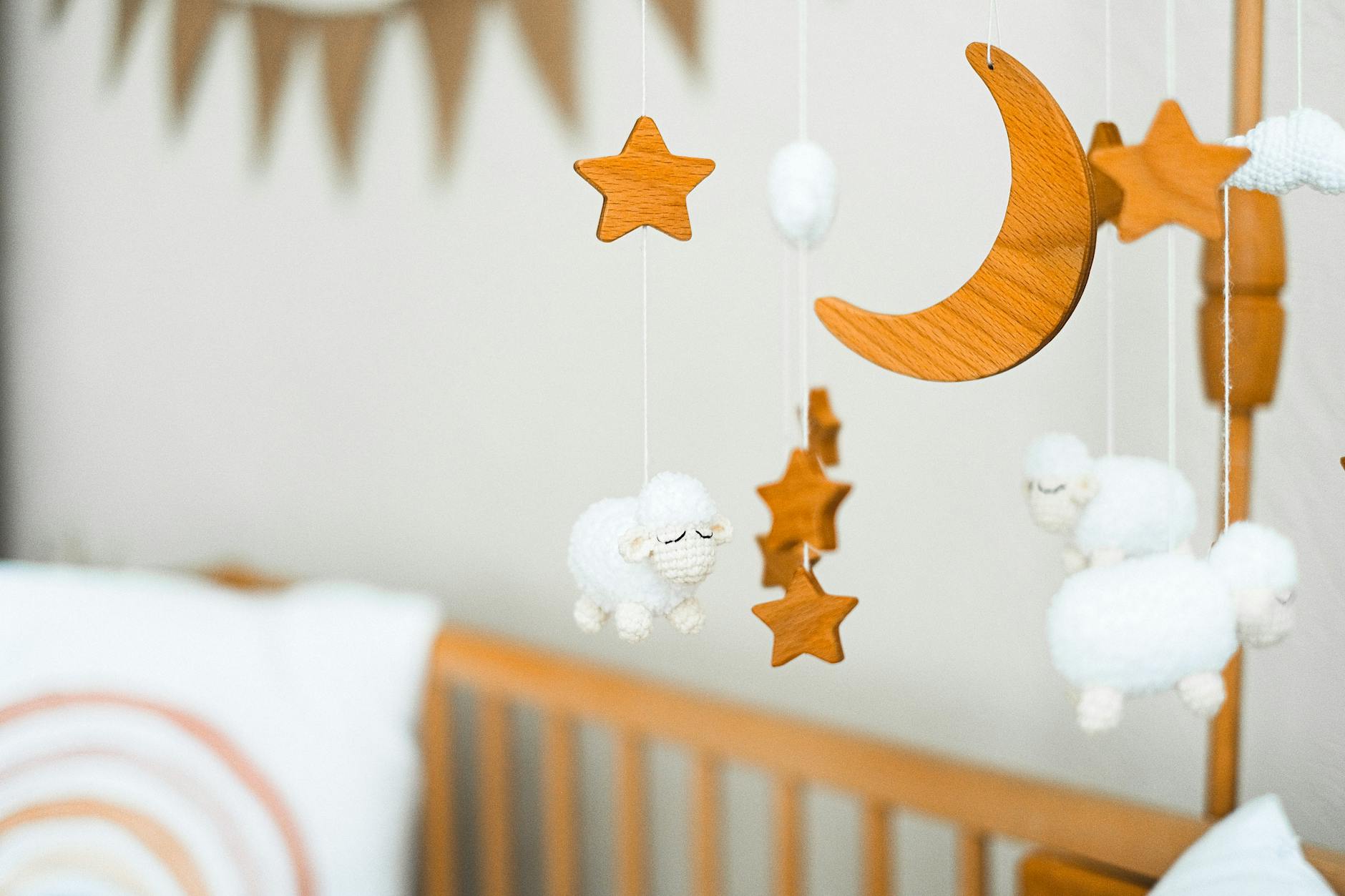 close up a wooden crib mobile