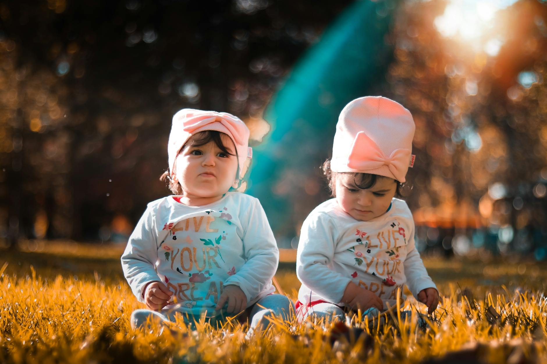 twins on grass field