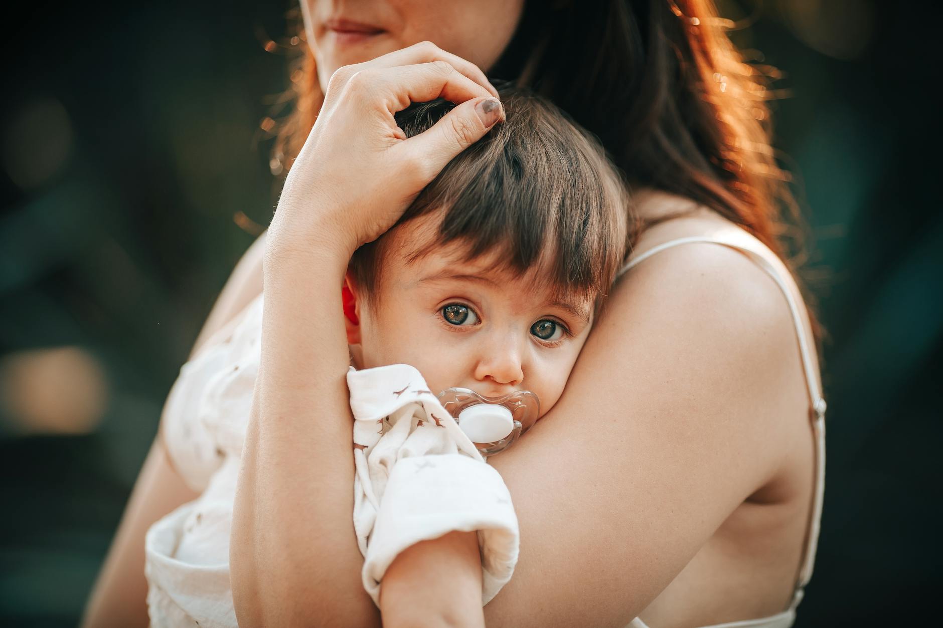woman holding a baby in her arms