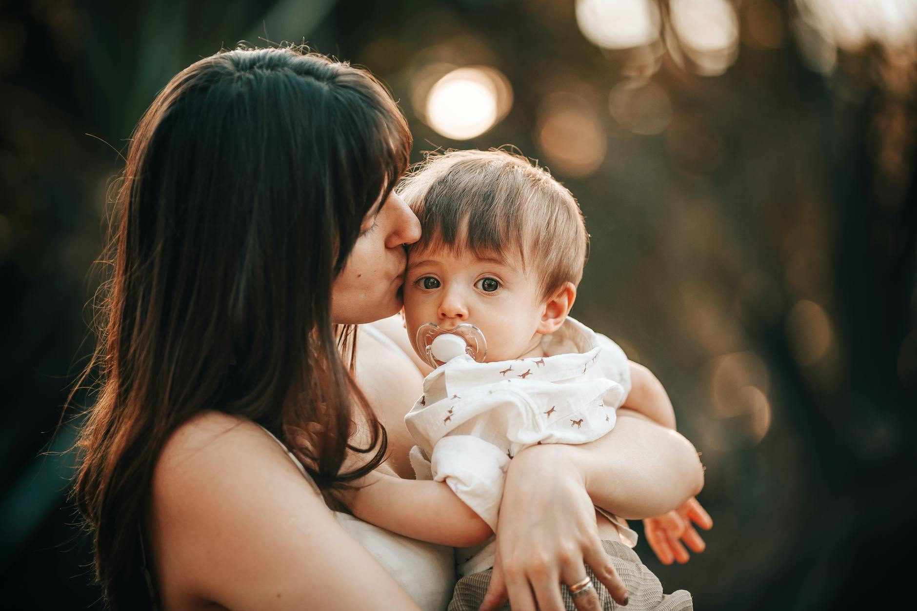 a woman kissing her son
