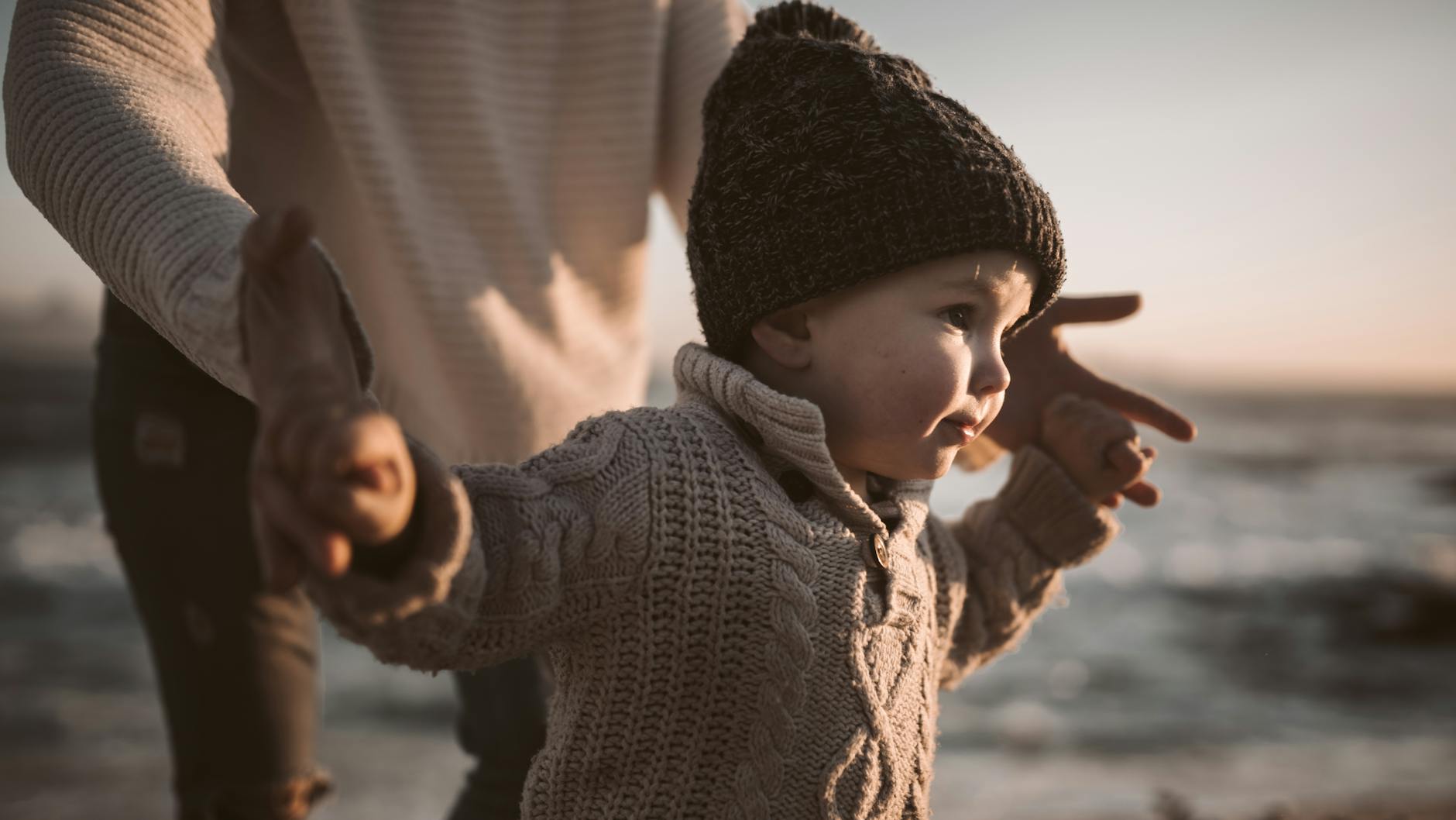 close up photo of baby wearing beanie