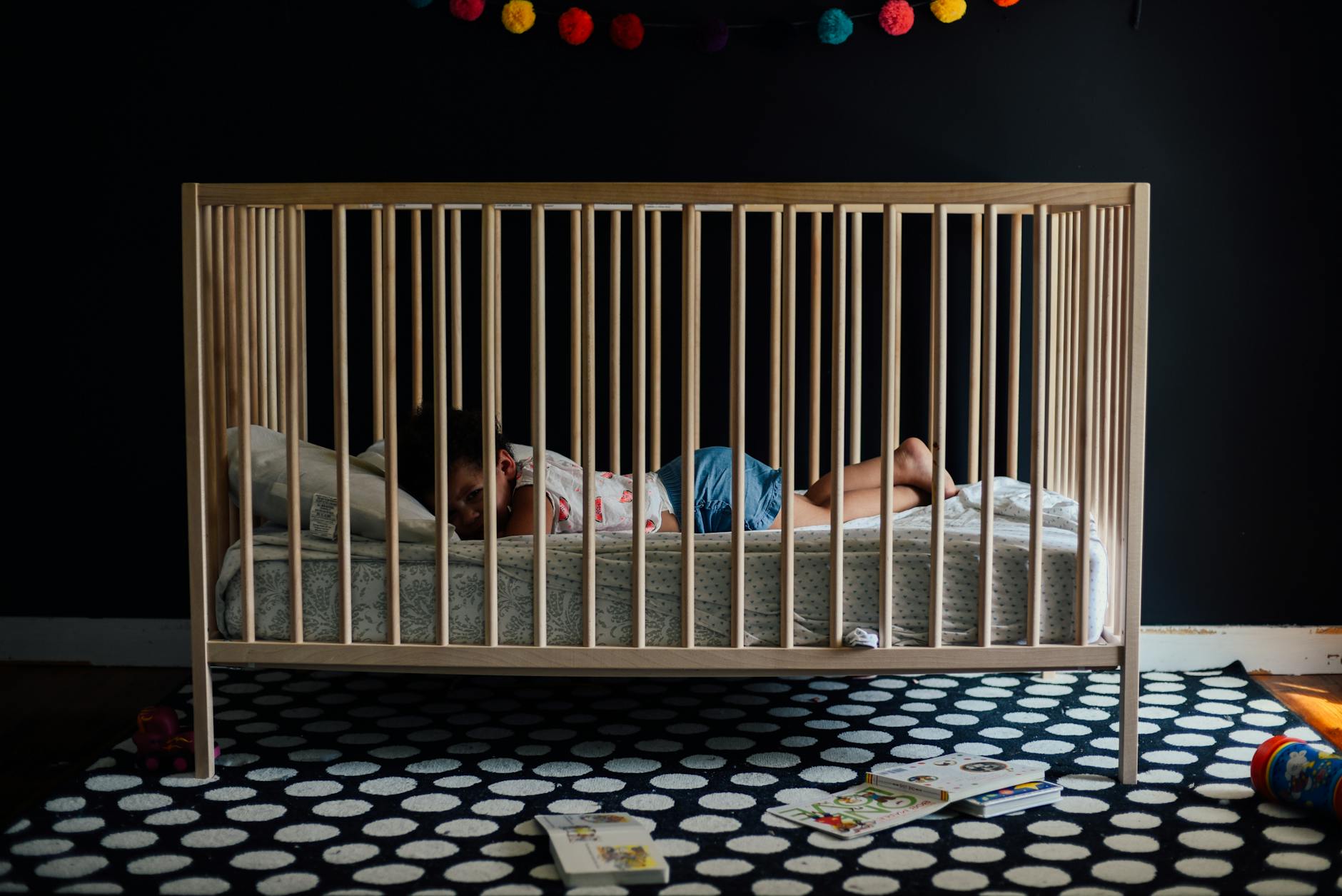 toddler in a crib