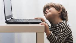 medium-shot-kid-looking-laptop