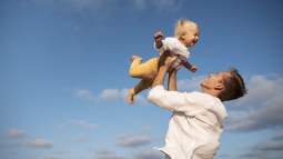 parent-with-baby-beach
