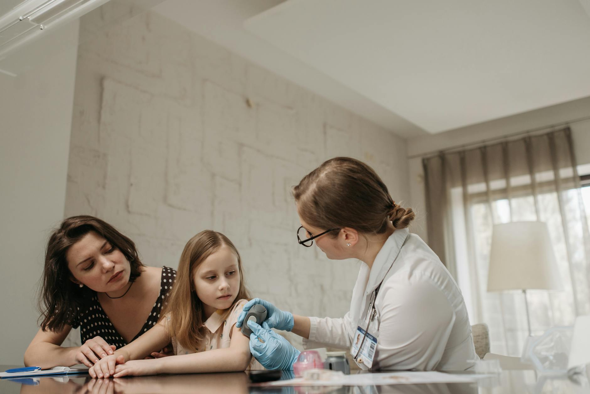 a doctor holding a glucometer