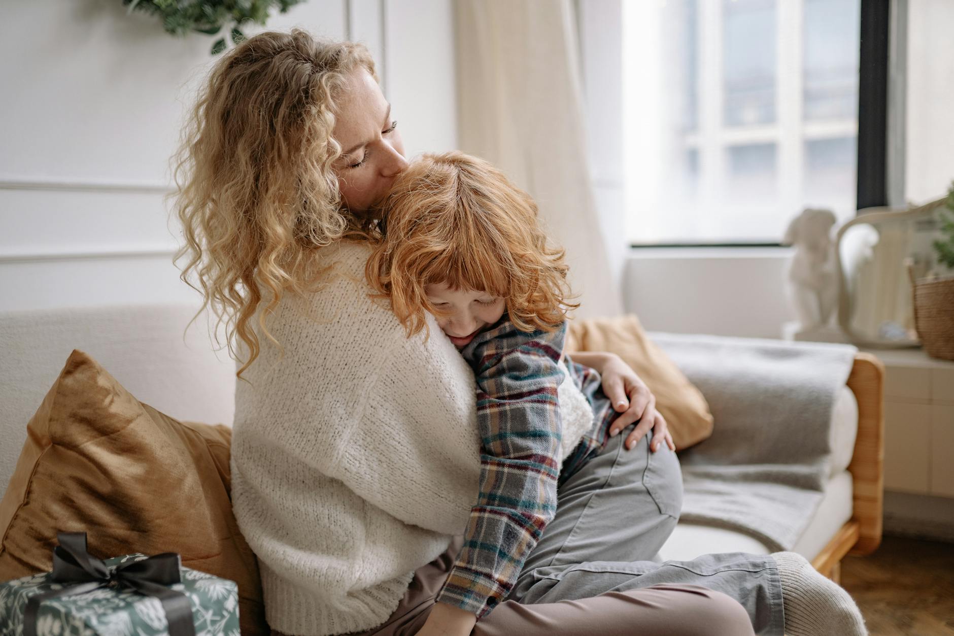 woman hugging a boy