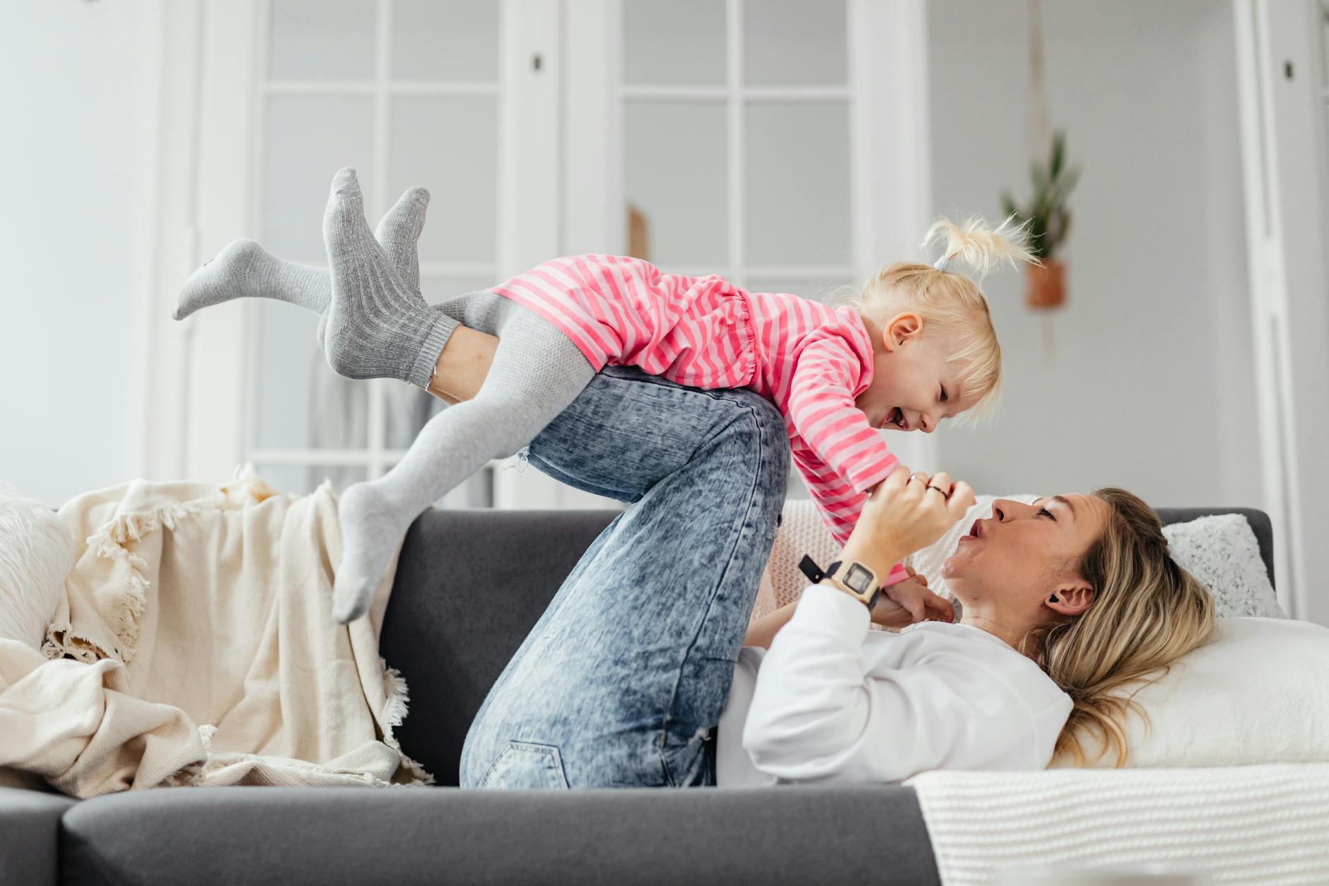 mother and daughter playing and laughing