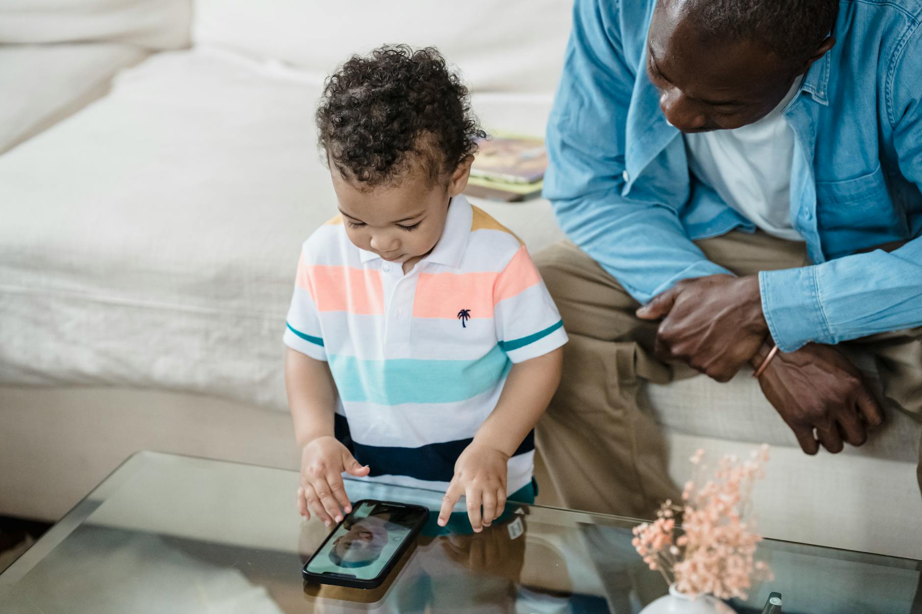 man and kid talking on video call